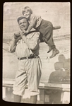1924 Original News Service Photo of Babe Ruth on California Barnstorming Tour – Carrying Child Actor Jackie Coogan on his Bat! (Encapsulated PSA/DNA Type 3)