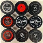 Chicago Blackhawks Signed Official NHL Game Puck Group of 16 Incl. Bobby Hull, Tony Esposito, Denis Savard and Others (BAS)