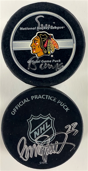 Ernie Banks and Ryne Sandberg Signed Hockey Pucks (BAS)
