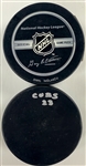 Ernie Banks and Ryne Sandberg Signed Hockey Pucks (BAS)