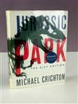 1993 Michael Crichton Signed Copy of <em>Jurassic Park</em> - Gift Edition with Acetate Cover (JSA)